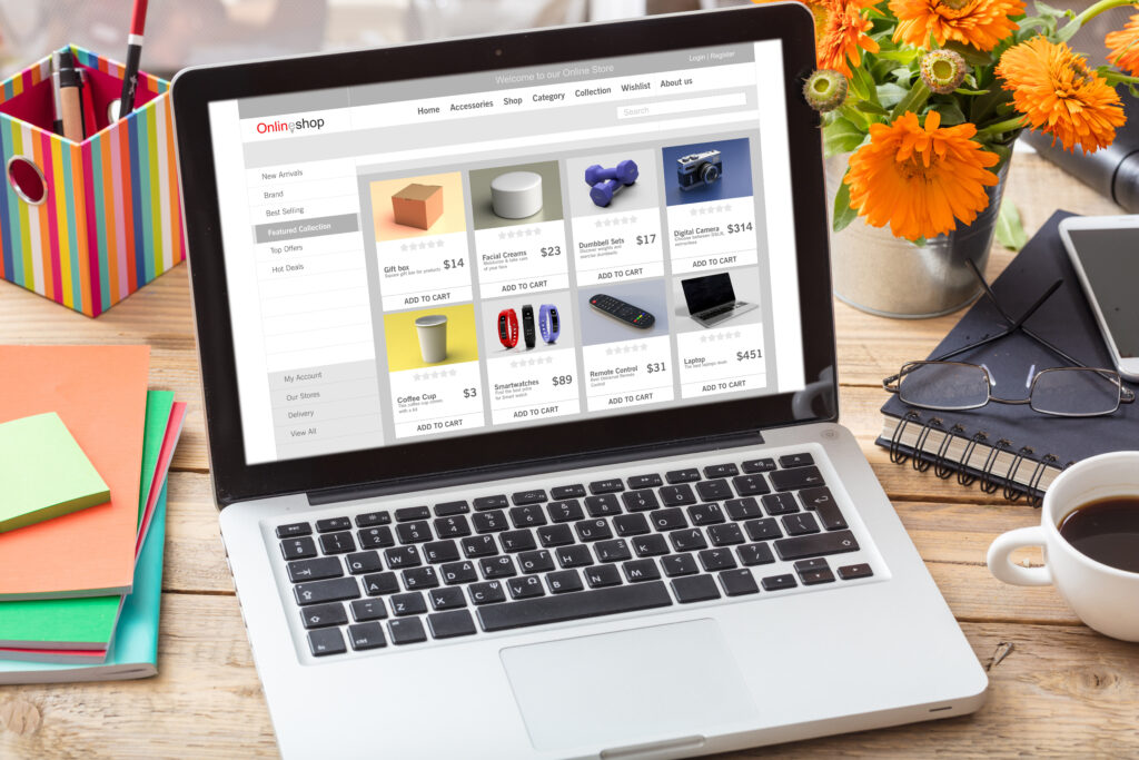 Eshop, ecommerce, digital marketing web page on a laptop computer screen, office desk background. Online shop website concept,